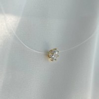 Colier pe fir transparent cu închizătoare și casetă din aur galben, decorată cu zirconiu Colier pe fir transparent cu închizătoare și casetă din aur galben, decorată cu zirconiu