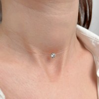 Colier pe fir transparent cu închizătoare și casetă din aur galben, decorată cu zirconiu Colier pe fir transparent cu închizătoare și casetă din aur galben, decorată cu zirconiu